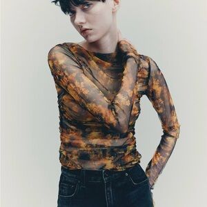 H&M STUDIO COLLECTION DRAPED MESH TOP
BLACK AND FLORAL